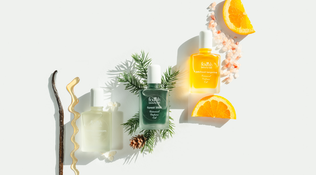 Botanical perfume oils trio with natural notes — spruce branch, honey, vanilla, and citrus — artisan perfumes handcrafted in Vermont.